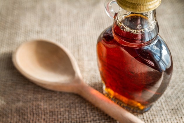 Maple Syrup Maple Syrup bottle and wooden spoon